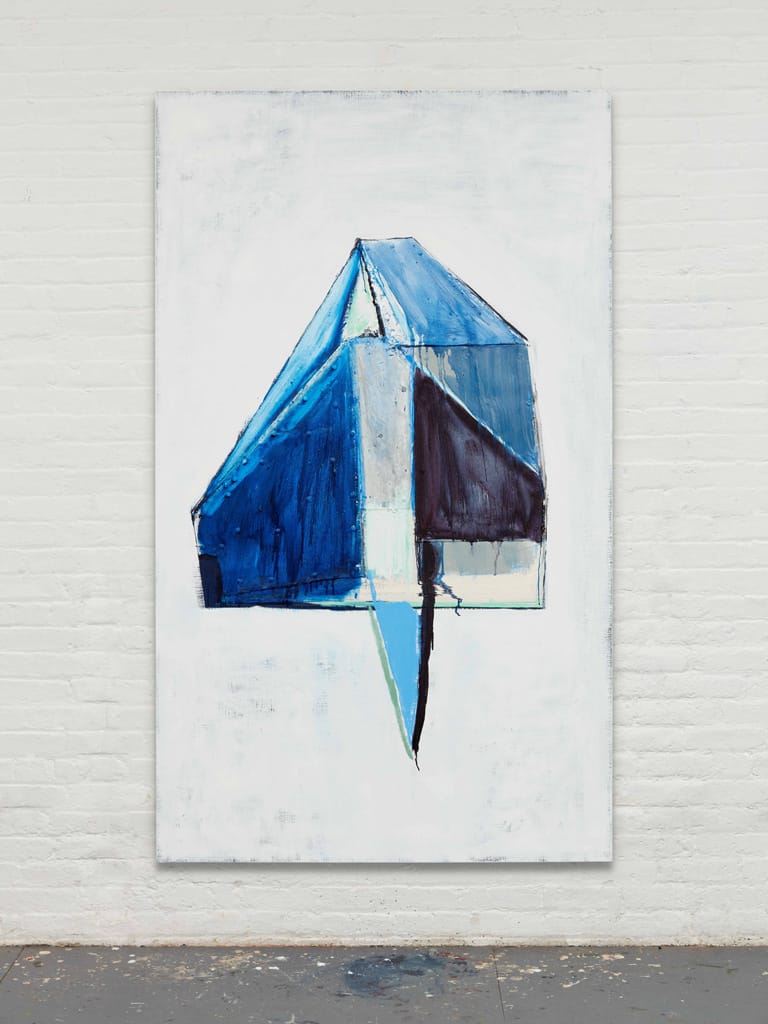 Abstract painting of a blue and white geometric shape on a white brick wall background.