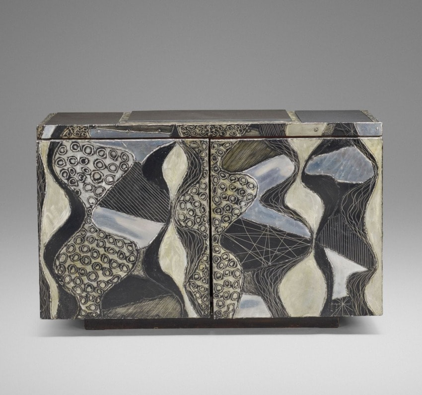 Decorative cabinet with abstract black, white, and gray patterns, featuring textured, wavy designs and intricate details.