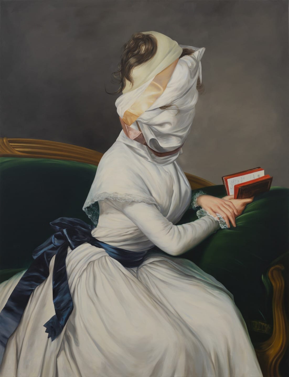 Surreal painting of a seated woman in a white dress with her head wrapped in cloth, holding two books on a green couch.