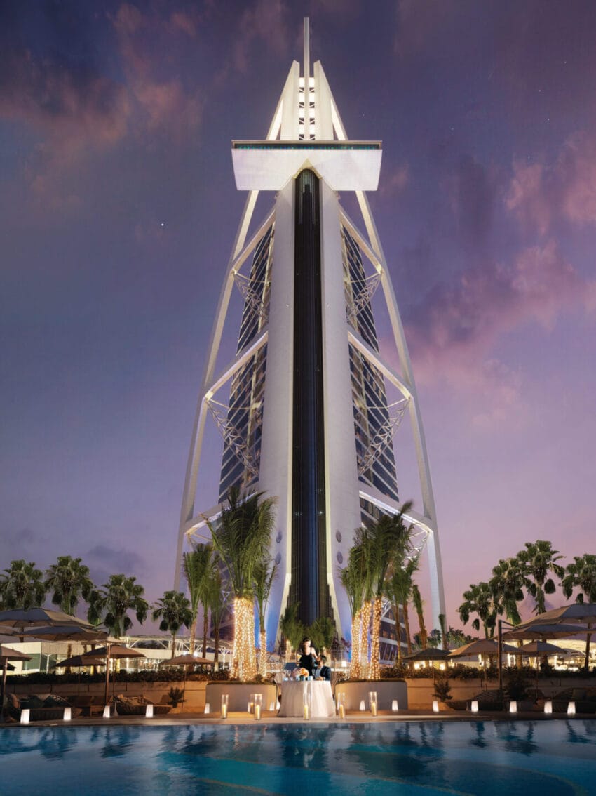 Iconic sail-shaped hotel in Dubai with a luxurious atmosphere, elegant design, and a stunning view at dusk from the poolside.
