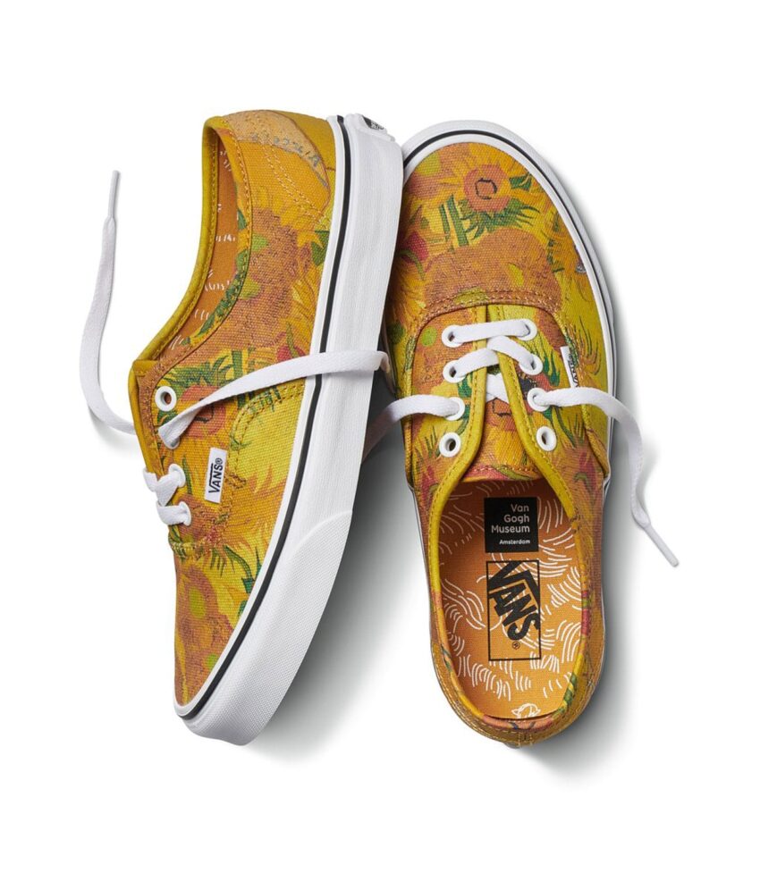 Yellow floral patterned Vans sneakers with white laces displayed on a white background.