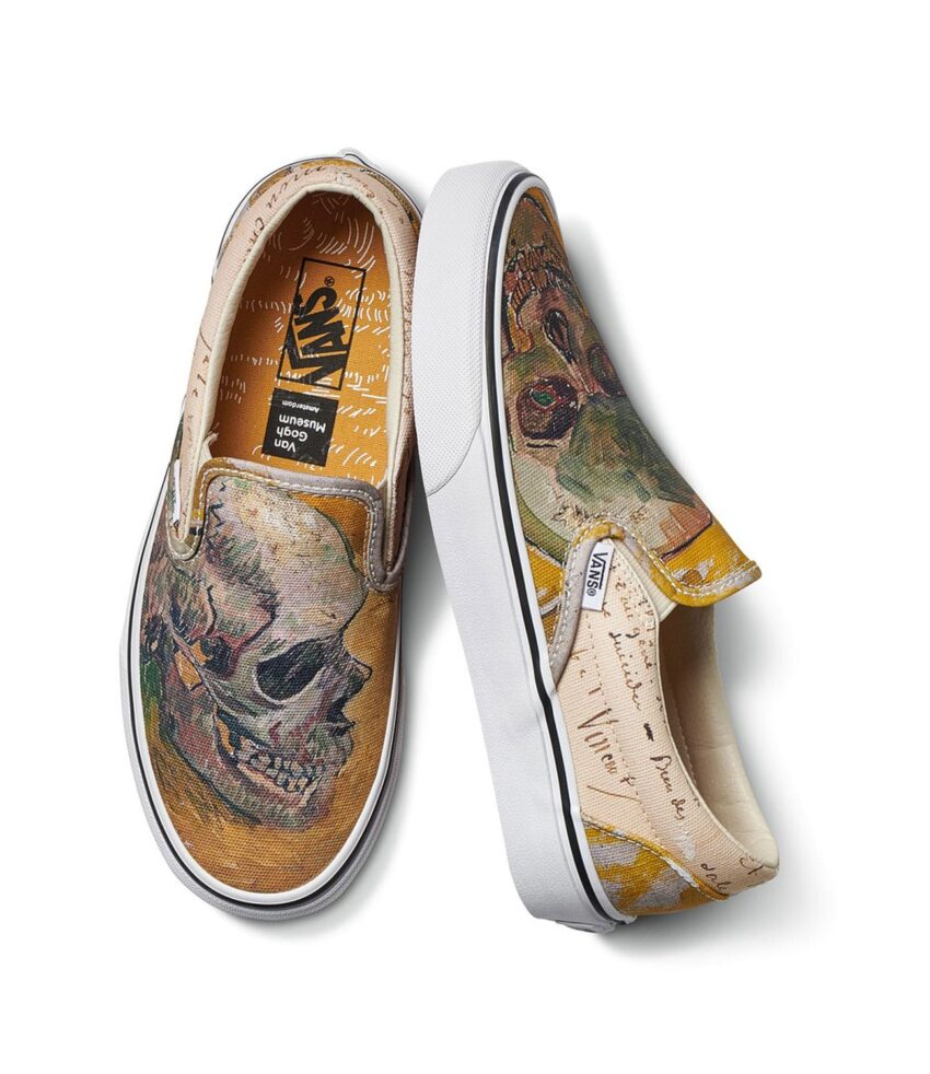 Vans slip-on shoes with a skull and abstract art design on a white background.
