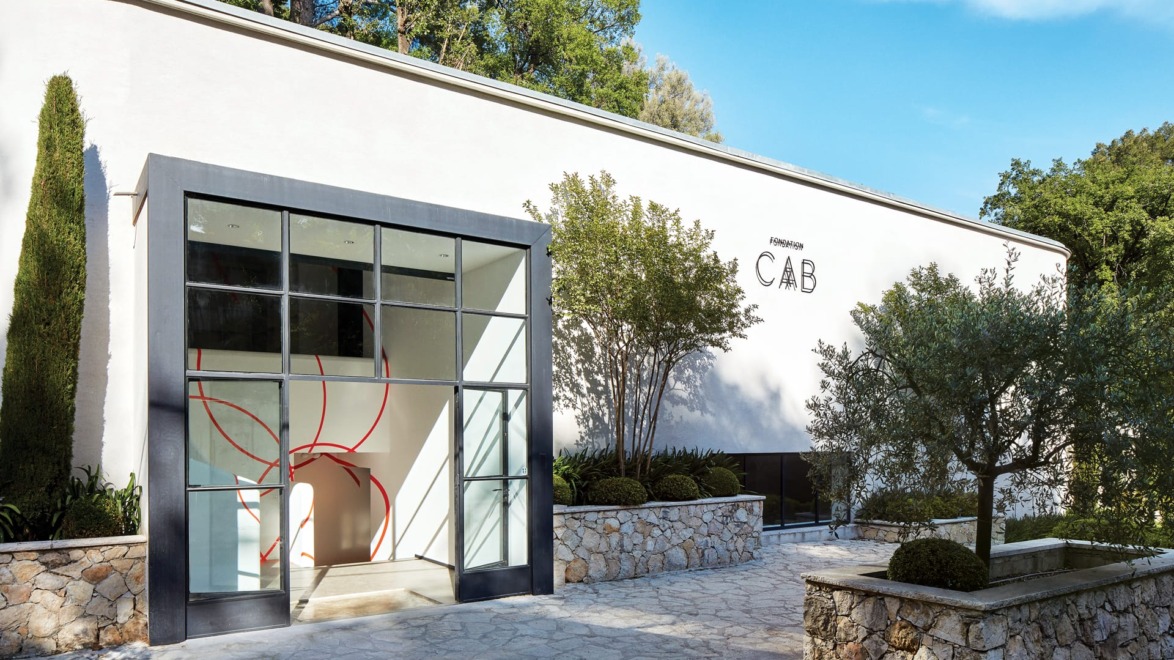 Exterior view of Anderson CAB art gallery with modern architecture and trees surrounding the entrance.