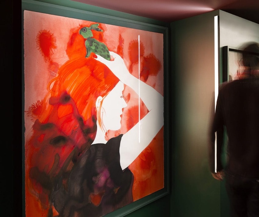 Vibrant painting of a woman with red hair holding a green rabbit, set against a bold, abstract red background.