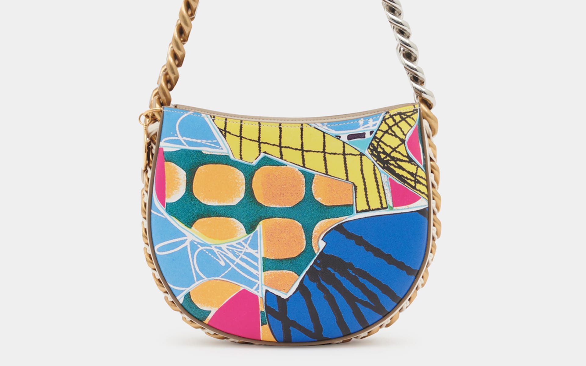 Colorful handbag with abstract geometric patterns and a gold chain strap.
