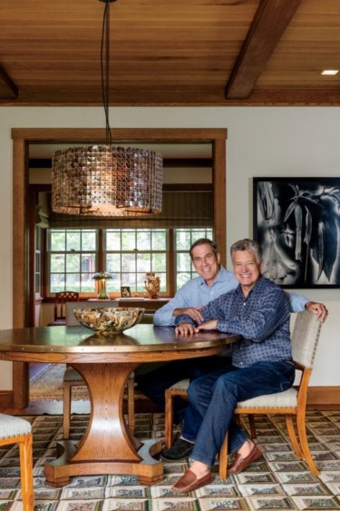 Tom Cashin, left, and Jay Johnson pose in the dining area that is adjacent to the study. The Sinclair dining table is from Jed Johnson Home, the dining chairs, upholstered in a fabric from Rogers & Goffigon, are from Soane Britain, in London, and the carpet is from Stephen T. Anderson. The photograph is the 1996 Datura, by Gary Schneider, an artist fromTom Cashin, left, and Jay Johnson pose in the dining area that is adjacent to the study. The Sinclair dining table is from Jed Johnson Home, the dining chairs, upholstered in a fabric from Rogers & Goffigon, are from Soane Britain, in London, and the carpet is from Stephen T. Anderson. The photograph is the 1996 Datura, by Gary Schneider, an artist from South Africa.