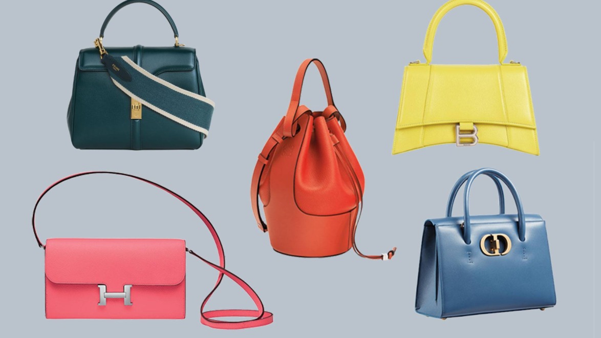 Collection of five stylish handbags in various colors and styles on a soft blue background.