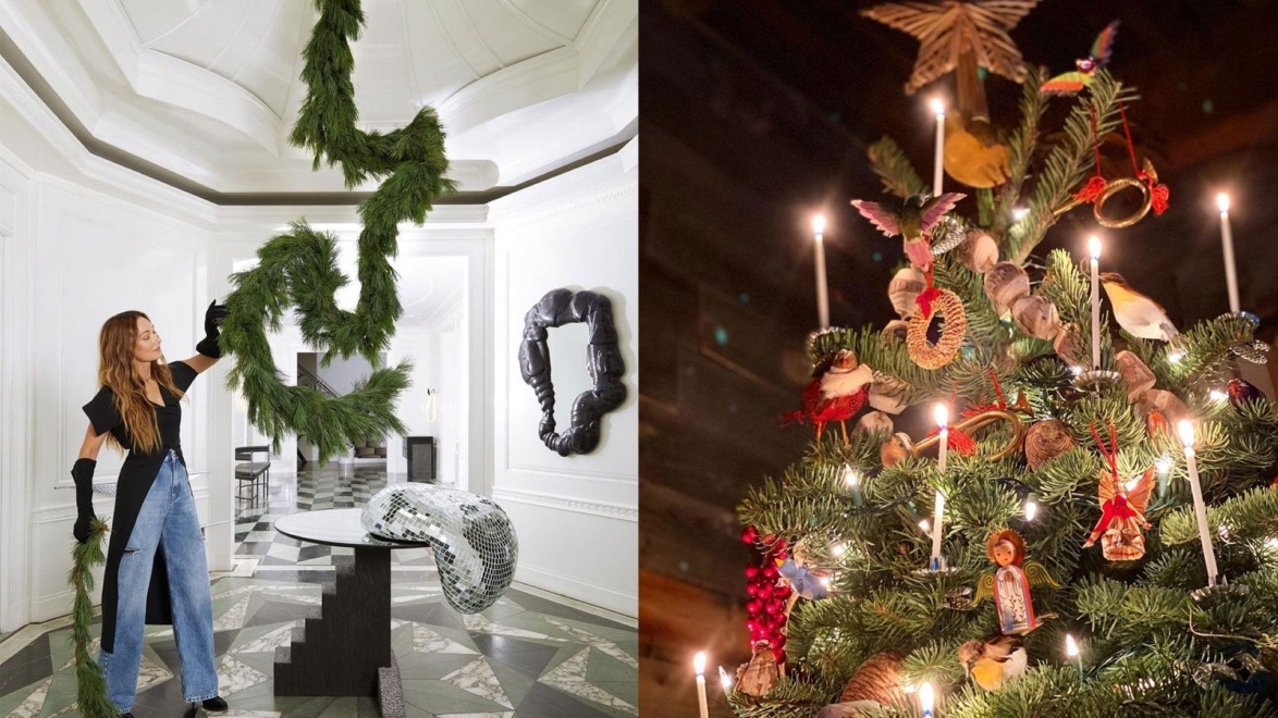 Person holding a green garland in a stylish room; decorated Christmas tree with candles and ornaments nearby.