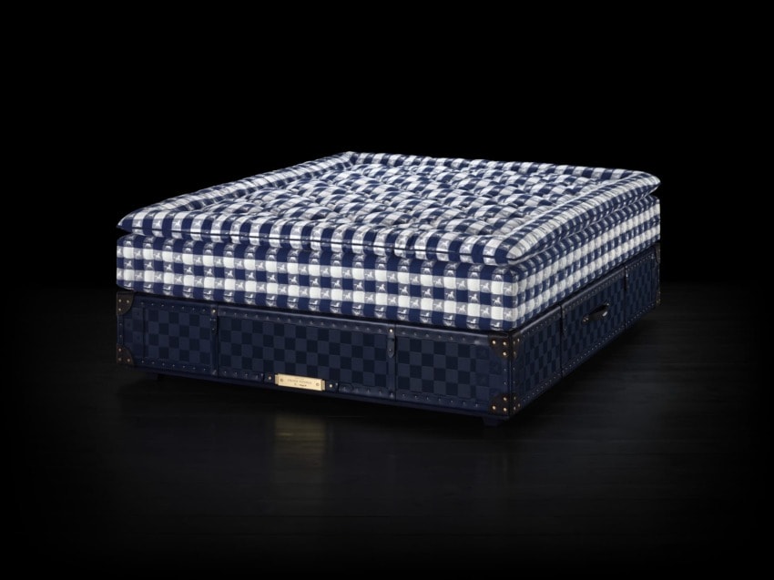 Luxury blue checkered mattress on a dark background, showcasing a plush design and premium craftsmanship.