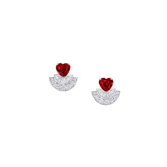 Heart-shaped ruby earrings with diamond accents on a white background.
