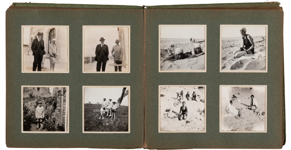 Vintage photo album with black and white pictures of people at the beach and outdoors on a textured paper background.