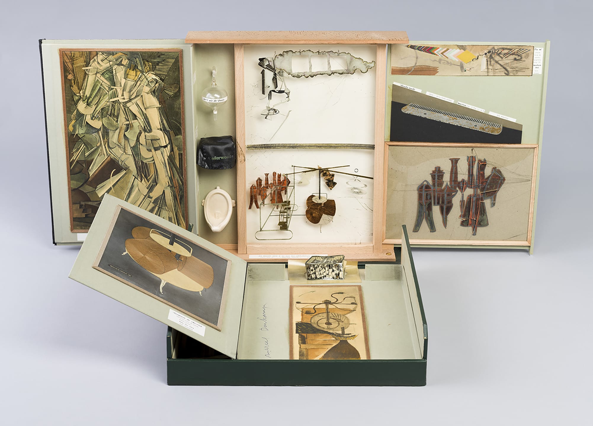 Duchamp's "Boîte-en-valise" unfolded showing miniatures and reproductions of his famous artworks in a portable case.