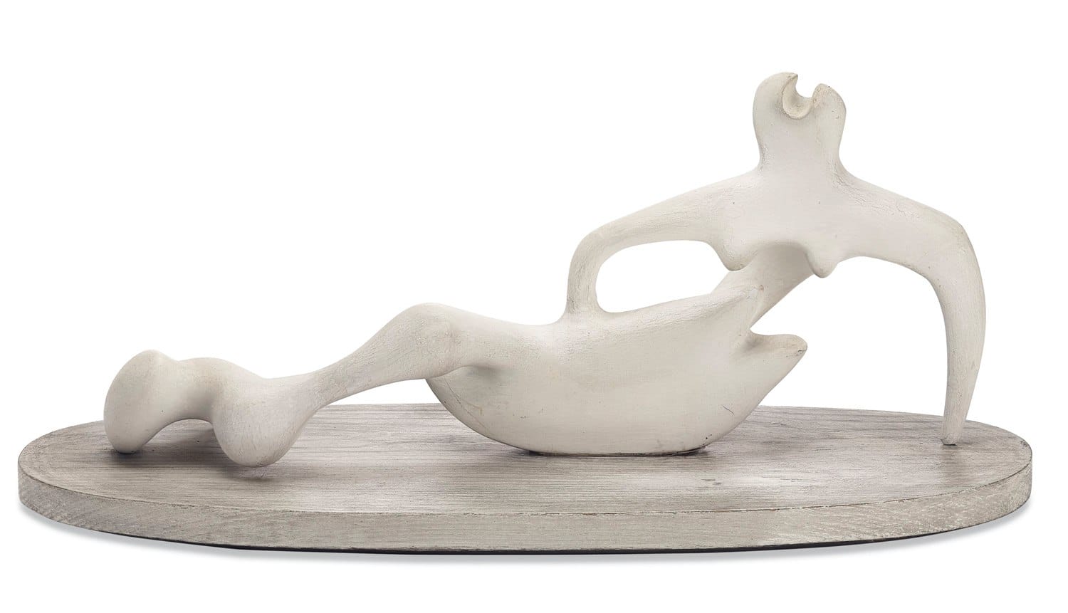 Abstract white sculpture of a reclining figure on a wooden base, showcasing modern artistic style and fluid form.