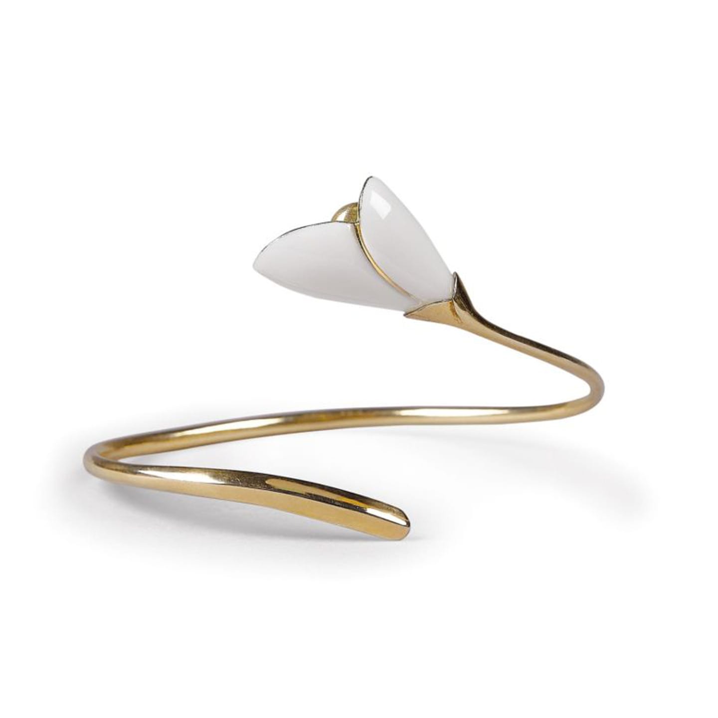 Gold bracelet with white enamel flower design on a curved band.