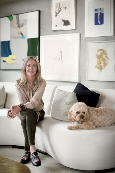Sue Hostetler is joined by her dog, Teddy, on the living room’s custom-made Vladimir Kagan sectional sofa, which is upholstered in a J. Robert Scott mohair.