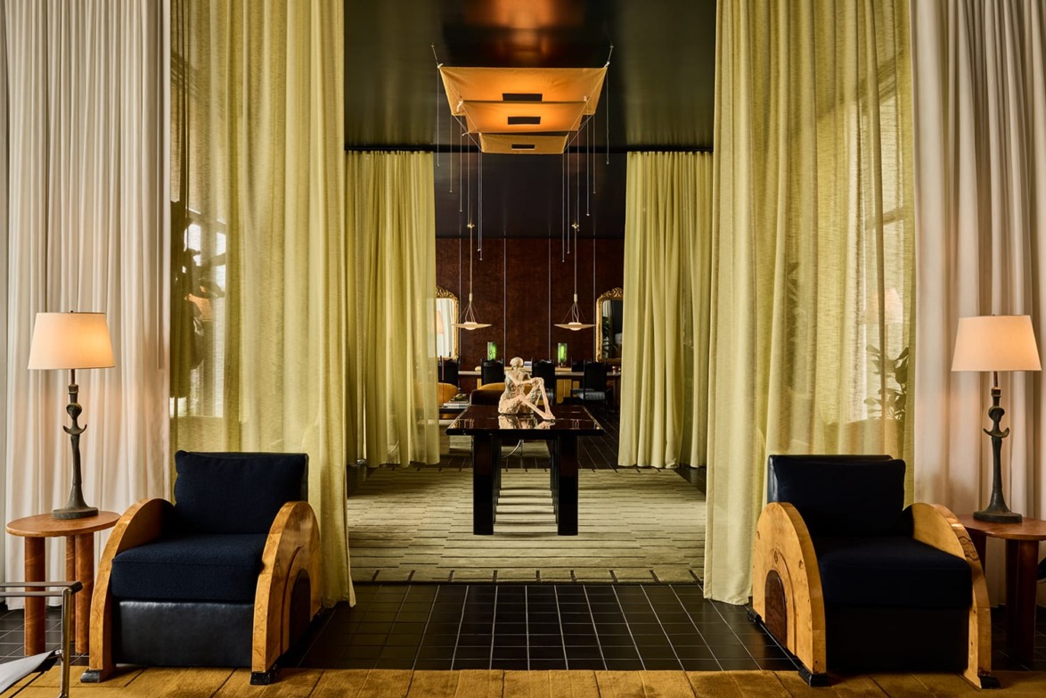 Sheer panels divide the myriad spaces in the lobby of the Hotel Saint Augustine in Houston, Texas.