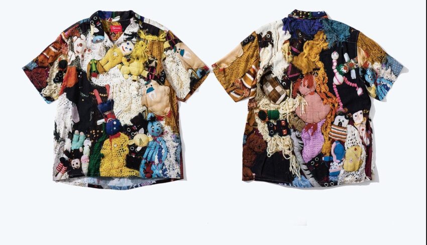 Colorful, eclectic shirts with a patchwork design of various stuffed animals and knitted elements on a white background.