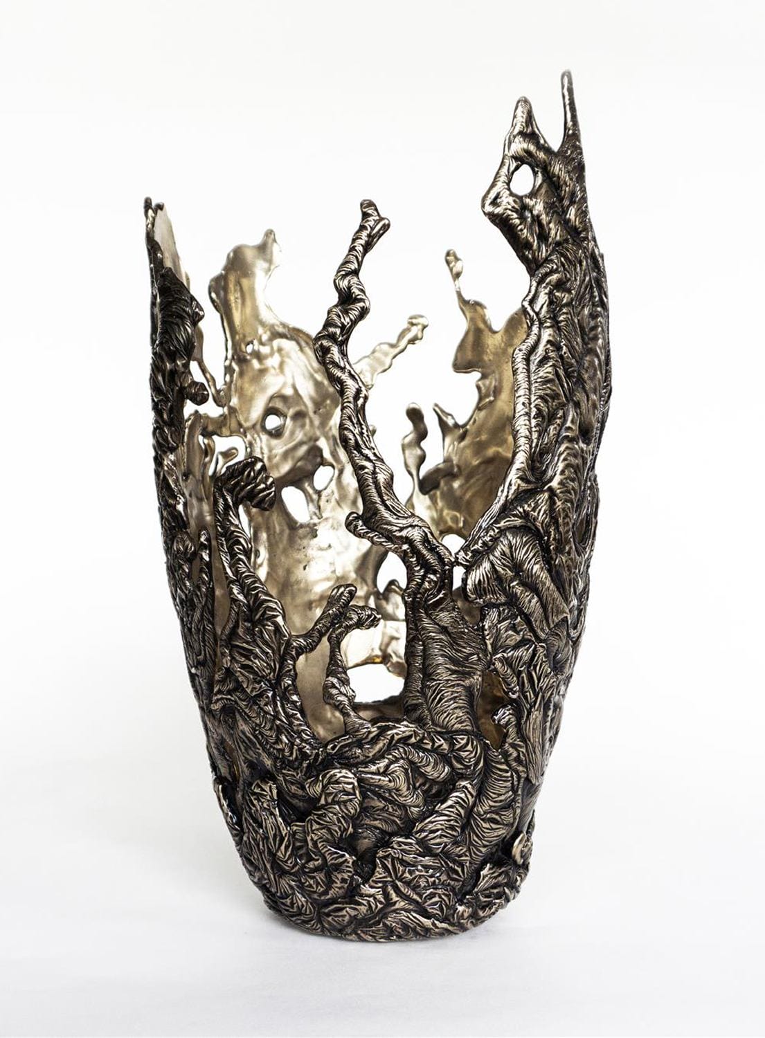 Intricately designed metallic sculpture resembling coral or tree bark with textured surface and hollow interior.