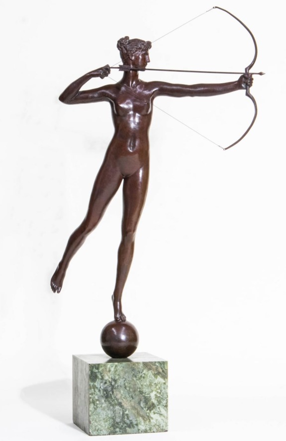 Bronze statue of a female archer balancing on a sphere, mounted on a green marble base