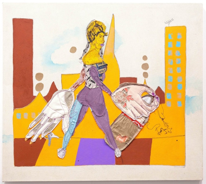 Abstract artwork of a woman composed of fabric and mixed media, set against a vibrant cityscape with tall buildings.