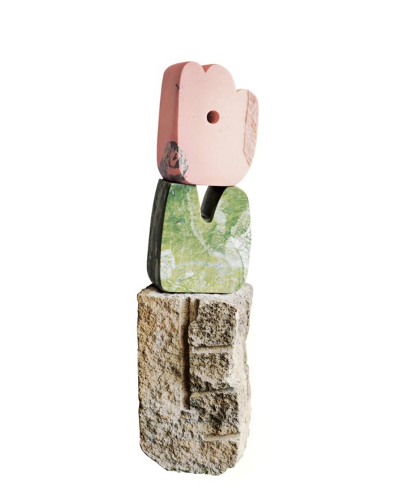Stacked abstract stone sculpture with pink, green, and textured natural stones against a plain white background