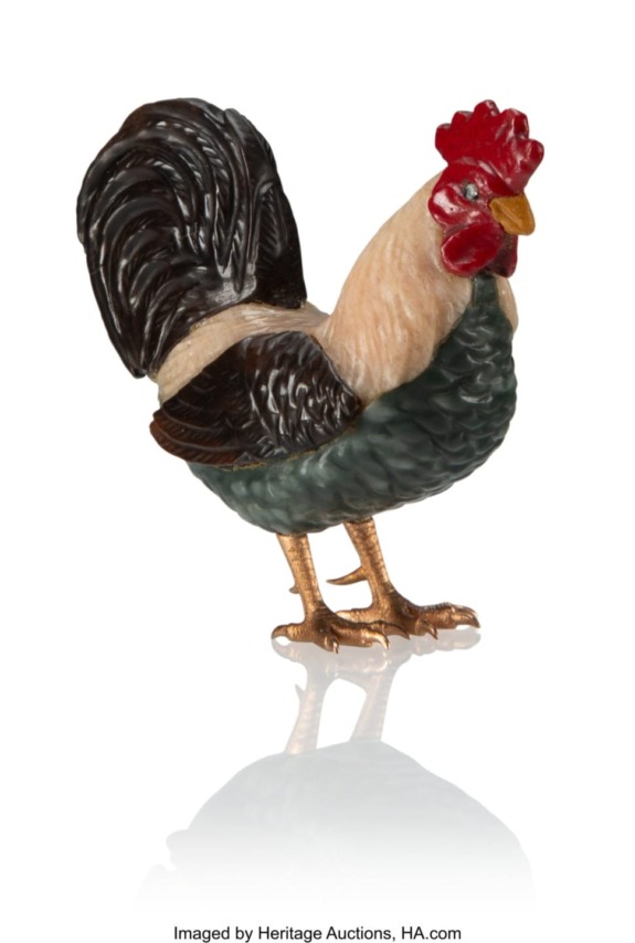 Detailed figurine of a rooster with red comb, green feathers, and reflective surface, set against a white background.