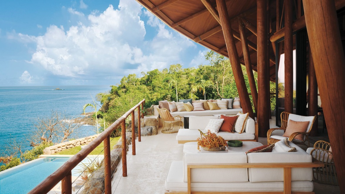 A deep-set porch off the living area runs parallel to the pool.