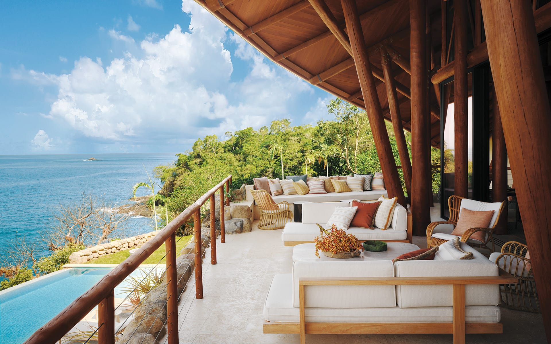 A deep-set porch off the living area runs parallel to the pool.
