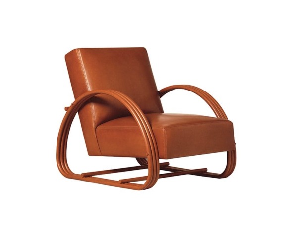 Retro brown leather armchair with curved wooden arms and a tilted backrest, featuring an art deco style design.
