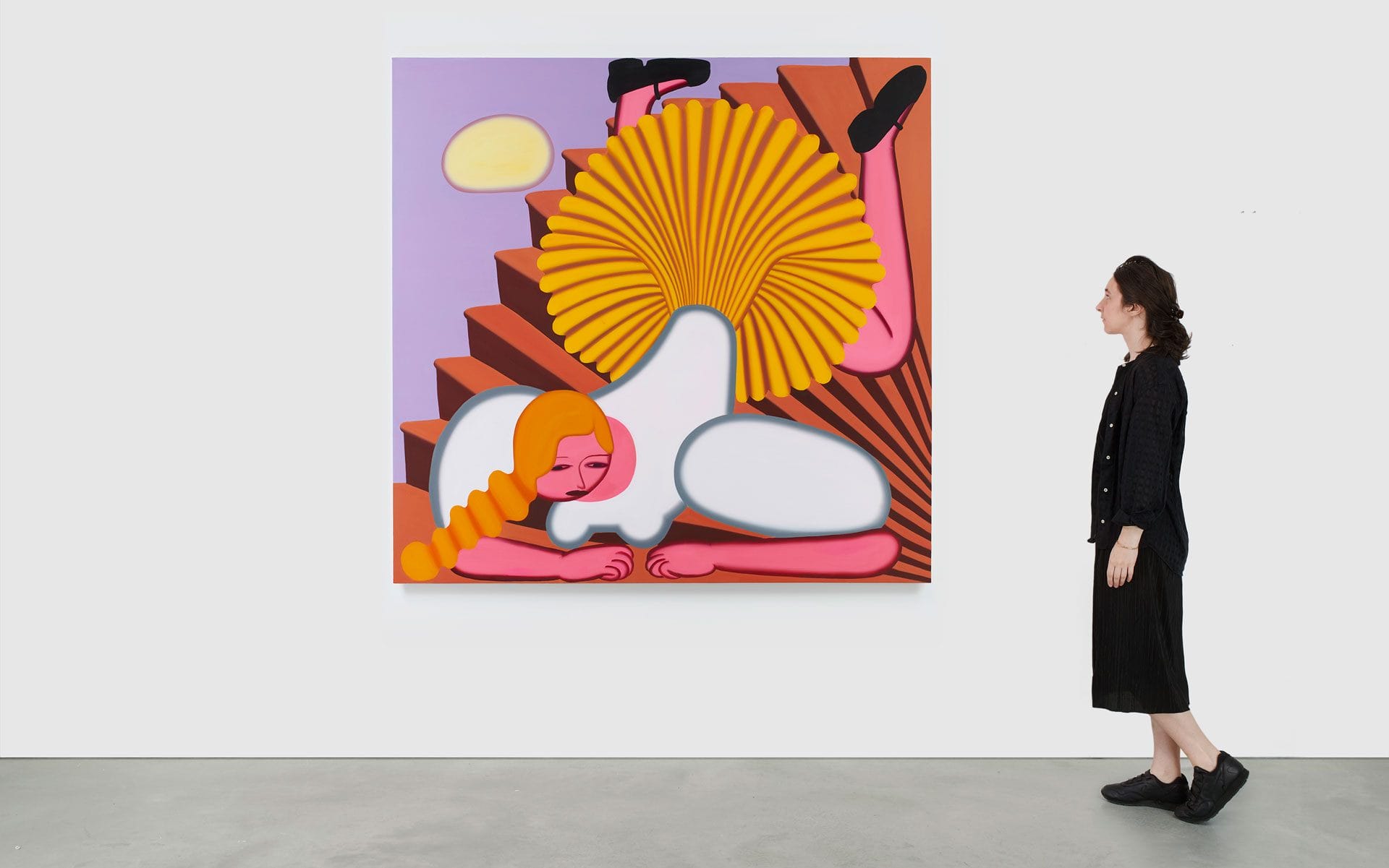 Person observing colorful abstract painting on steps with shapes and human-like elements in a modern gallery setting.