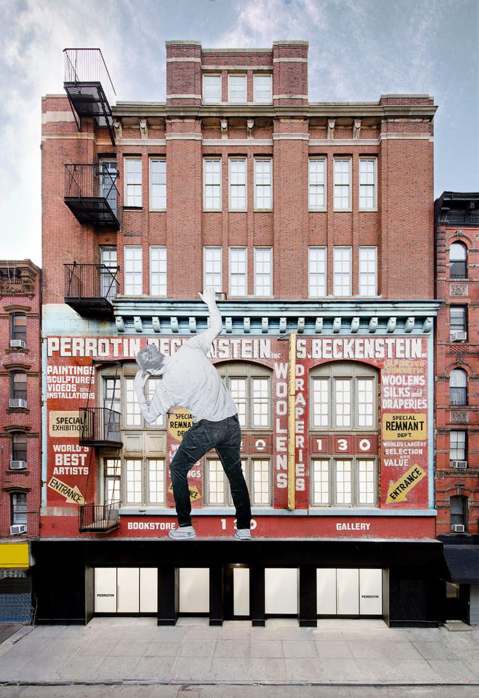 Person in dynamic pose on building facade with vintage advertisements, bookstore and gallery at street level.