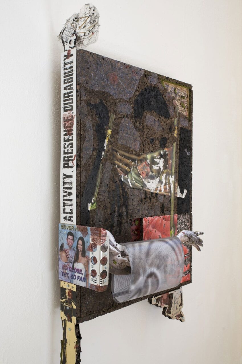 Mixed media artwork with diverse materials, displaying layers, textures, and images, including a skull and printed text.