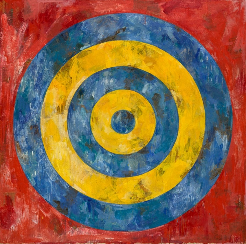 Circular abstract painting with blue and yellow concentric circles on a red background.