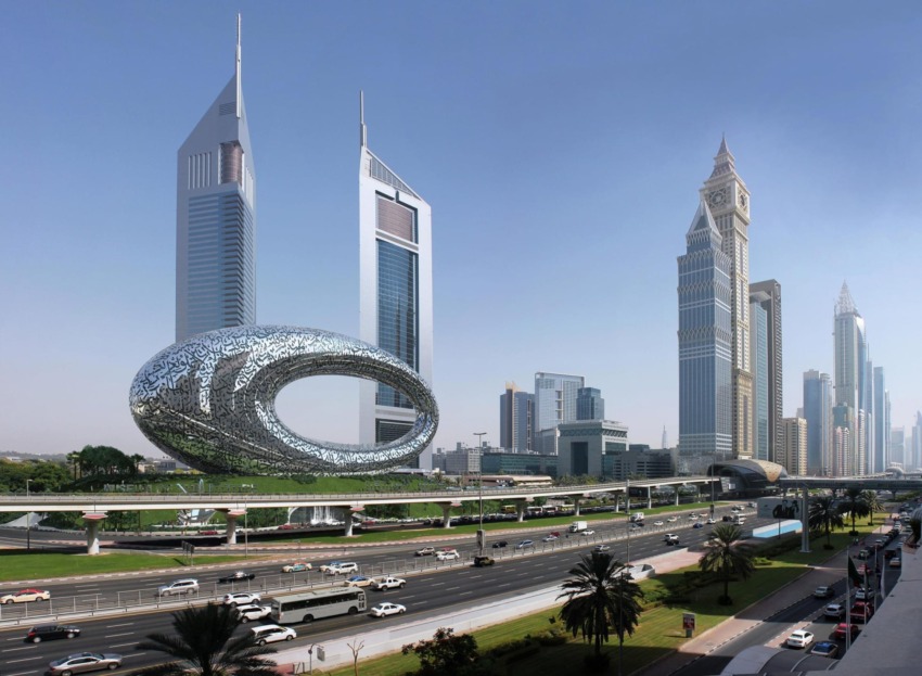Futuristic Museum of the Future building with geometric design in Dubai cityscape, surrounded by tall skyscrapers and busy road.