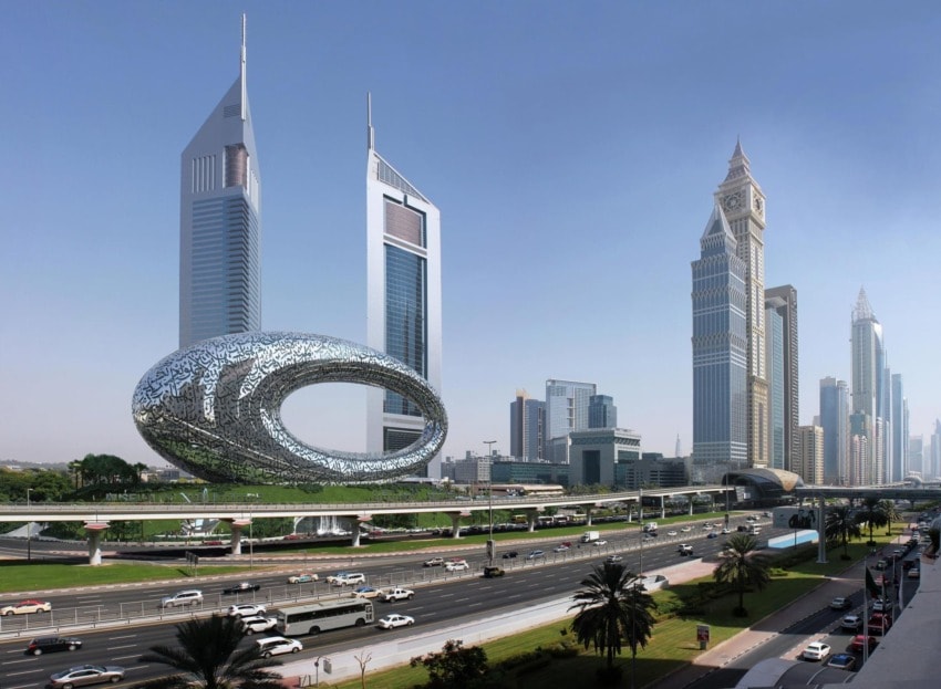 Futuristic Museum of the Future building with geometric design in Dubai cityscape, surrounded by tall skyscrapers and busy road.