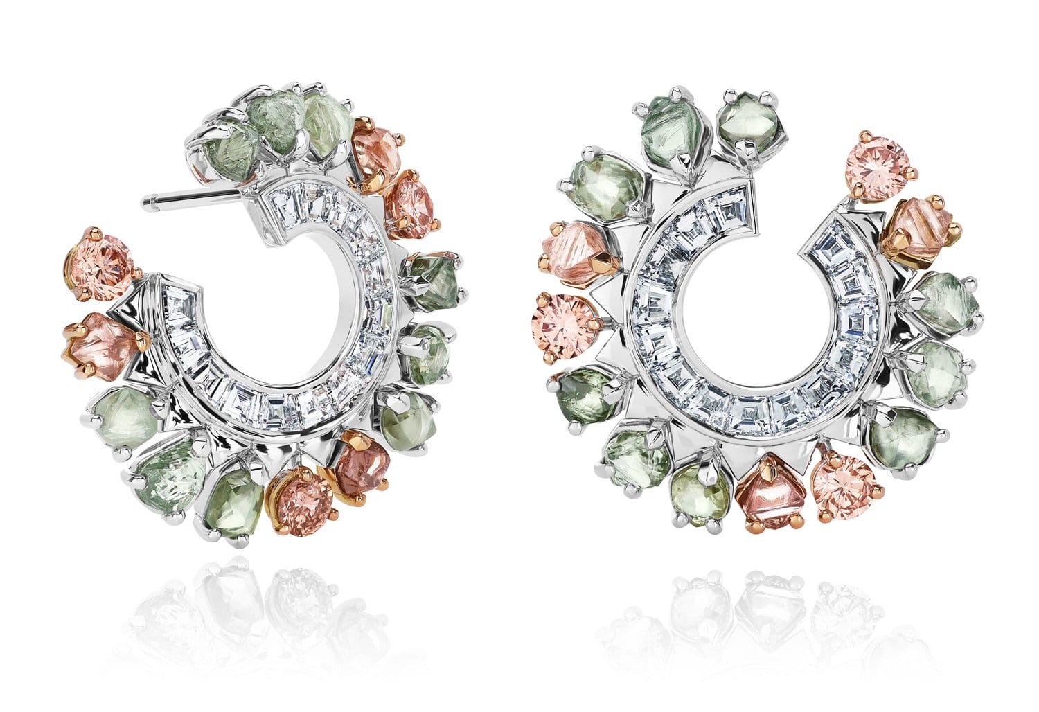 Colorful gemstone earrings with circular silver design, featuring green, pink, and clear stones on white background.