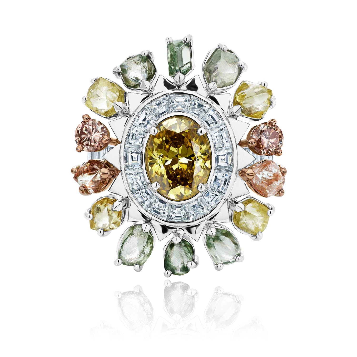 Colorful gemstone flower brooch with a yellow center and surrounding multicolored stones on a reflective white surface.