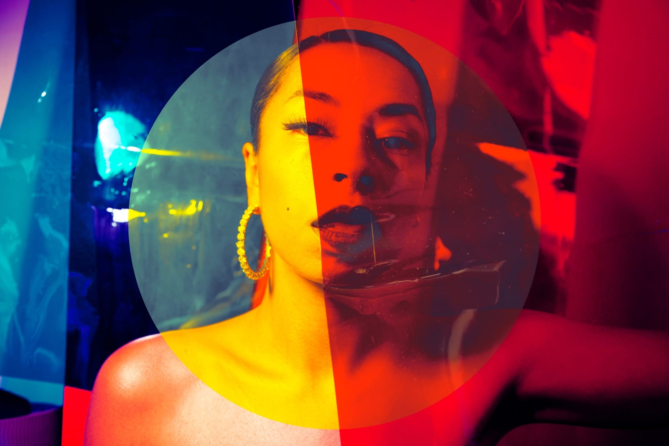 Artistic portrait of a woman with vibrant, colorful lighting and circular overlay effect.