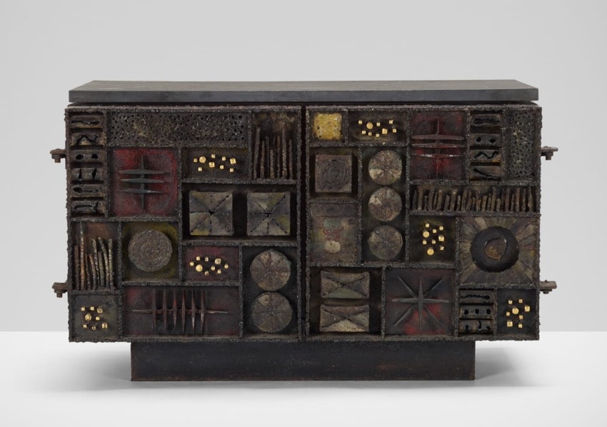 Mid-century modern cabinet with geometric patterns, dark tones, textured finish, and abstract design elements on display.