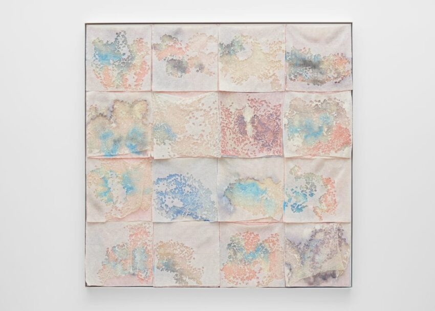 Abstract art piece with sixteen square panels, each featuring pastel watercolor designs with blue, pink, and beige hues.