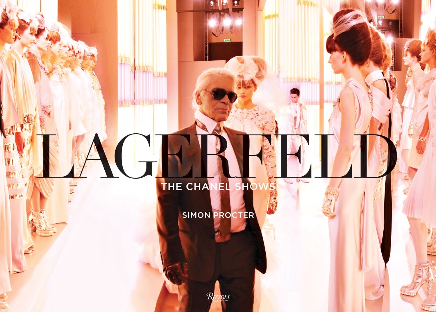 Book cover for "Lagerfeld: The Chanel Shows" by Simon Procter, featuring a fashion show scene with models and designer.
