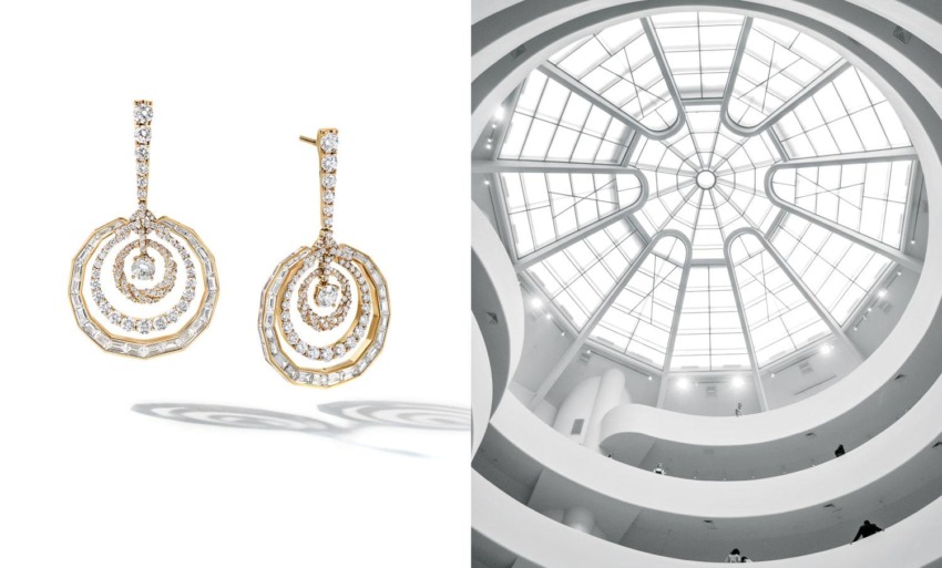Gold and diamond chandelier earrings alongside architectural view of a spiraling building interior with glass dome ceiling.