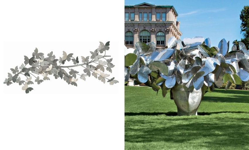 Metallic leaf sculpture on left, large mirrored leaf sculpture outdoors on right with building and trees in background.
