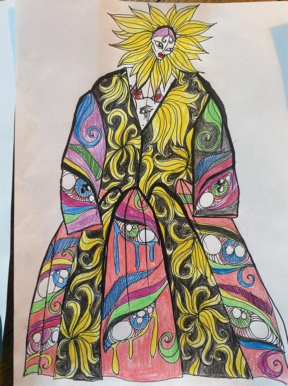 Colorful, abstract drawing of a figure with sun-like head, swirling patterns, and vibrant colors, wearing a long robe.