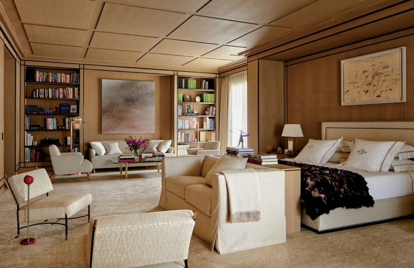 In the master suite, a painting by Twombly is mounted above the bed, while an Ed Ruscha canvas presides over the far sitting area with a custom-made sofa and armchairs, all covered in a Jim Thompson fabric; the Liaigre love seat at the foot of the bed is in a Loro Piana cashmere, and the carpet is by the Rug Company. López’s dressing room features a Donald Judd sculpture and a Knoll Mies van der Rohe daybed.
