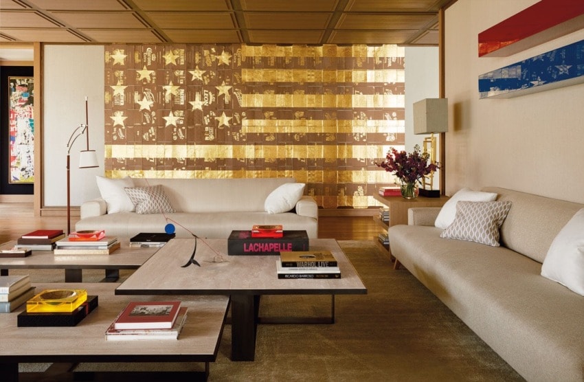 An overscale Danh Vo American flag painting and a two-part wall piece by John McCracken feature in the living area of collector Eugenio López’s home. The tabletop sculpture is by Alexander Calder.