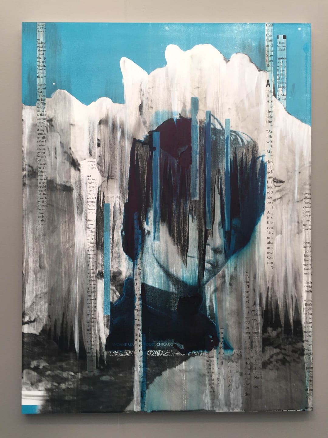 Abstract painting with an obscured face, featuring vertical brushstrokes in blue, black, and white tones, with text fragments.