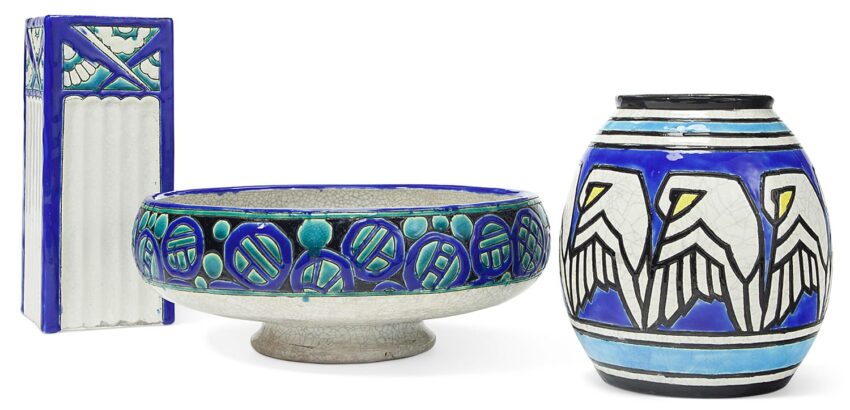 Three ceramic pieces with blue, teal, and white geometric patterns featuring a tall vase, a bowl, and a round vase.