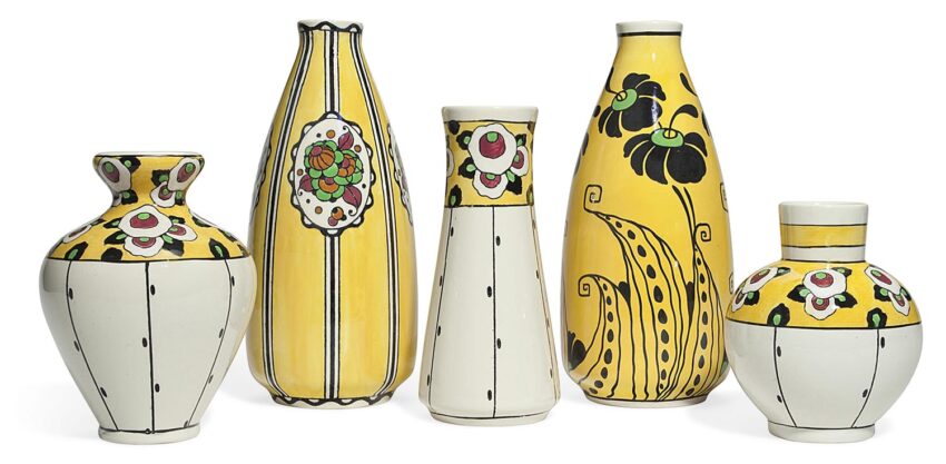 Set of five decorative ceramic vases with colorful floral and stripe patterns, featuring yellow, black, and green designs.