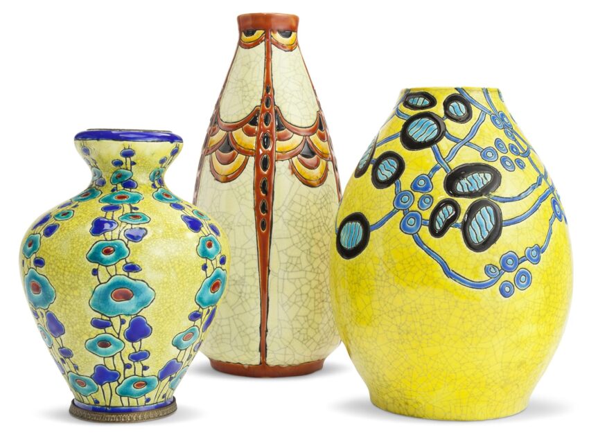 Three decorative ceramic vases with colorful floral and geometric patterns displayed against a white background.